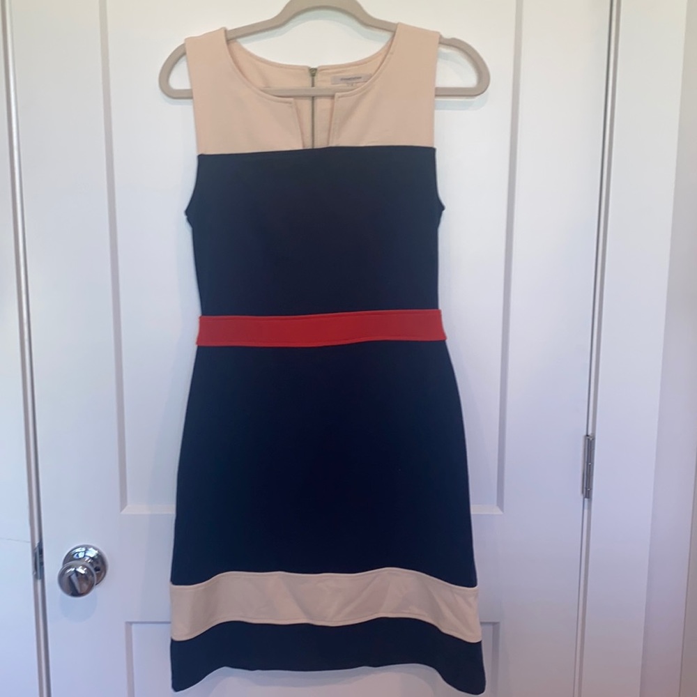 Never worn. Red stripe